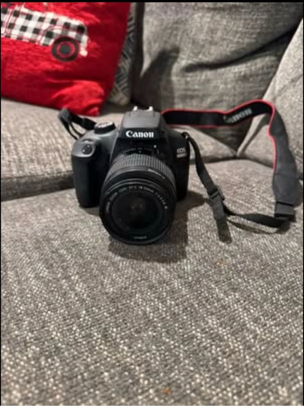 Canon DSLR Camera with Black Body and Red-Trim Strap